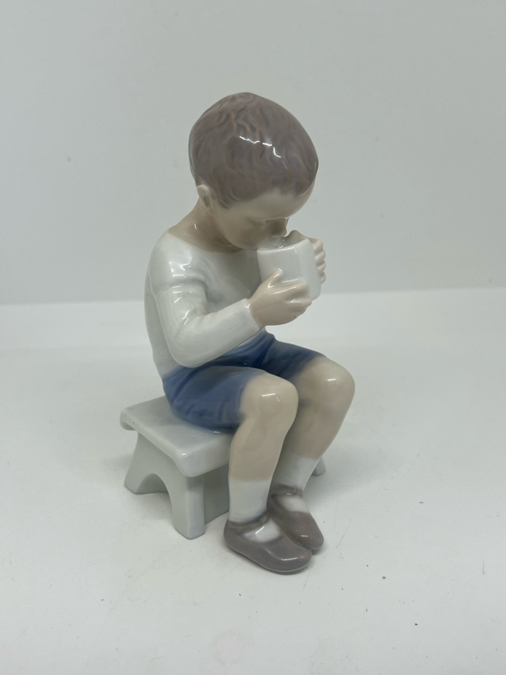 Royal Copenhagen “Boy Drinking Cup of Milk “ #1713